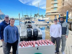 4 friends enjoying a day of fishing at Panama City Beach