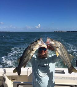 Two snook caught fishing in Port Canaveral FL waters from boat deck