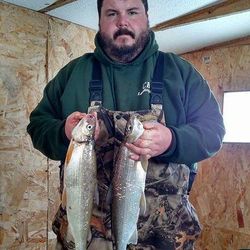 Two fishing rods with line in the water in OH
