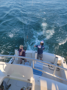 Two anglers enjoying a day of fishing in Maryland