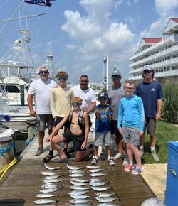 7 people fishing in the ocean at Ocean City