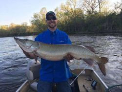 Angler with a muskellunge fish in Wisconsin
