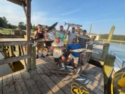 7 anglers with a large fish from Calabash