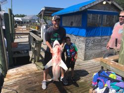 Three anglers with a 24-inch fish in North Carolina