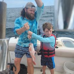 Two people fishing in Gulf Shores