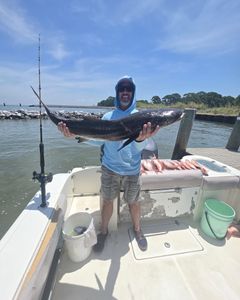 Large cobia caught fishing in Gulf Shores AL displayed on boat deck