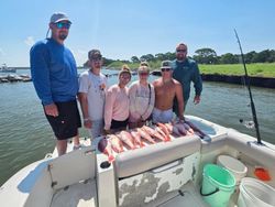 Fishing trip in Gulf Shores AL showing fresh catch displayed on boat