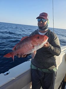 Angler enjoying fishing trip in Gulf Shores