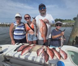 Successful red snapper and Spanish mackerel fishing trip in Gulf Shores Alabama with multiple fish displayed on boat deck