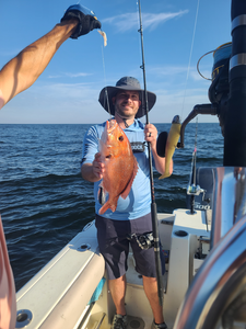 Reeling in a Red Snapper on a partly cloudy day!