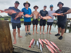 Triple Red Snapper success in Gulf Shores' partly cloudy waters!
