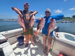 Red snapper fishing catch display on boat in Gulf Shores AL