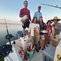 A group of 6 people fishing in AL with 2 big fish