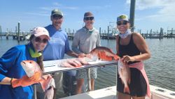 3 fishing enthusiasts enjoying a day at the Gulf Shores