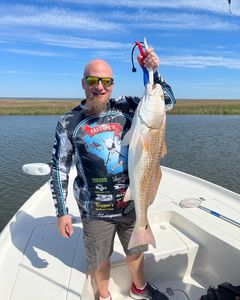 Jason’s first ever bull red. Shell Beach, LA