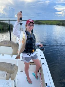 Madison with first Louisiana redfish. 