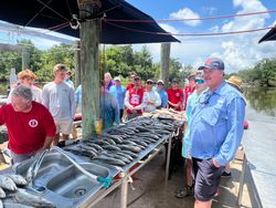 Group of 14 people on fishing tour in Hopedale