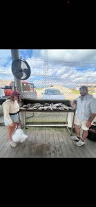 Two people enjoying a fishing tour in LA