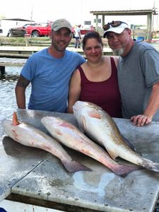 Two fishermen with big fish caught in Hopedale