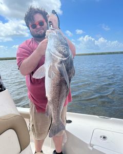 Angler with 27-inch fish in Hopedale