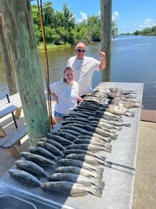 Two anglers with a couple of big fish in LA