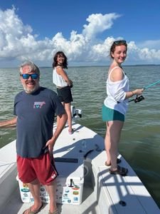 Three people enjoying a fishing trip in Key Largo