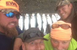Anglers fishing in Alaska with 2 fish