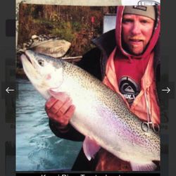 Angler with a rainbow trout in AK