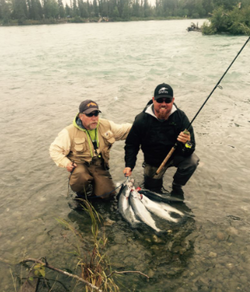 Two people enjoying the outdoors in Kenai, Alaska while fishing