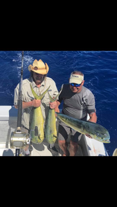 Two anglers enjoying a successful fishing trip in Kailua-Kona