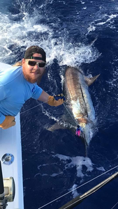 Angler holding a fishing rod in Kailua-Kona