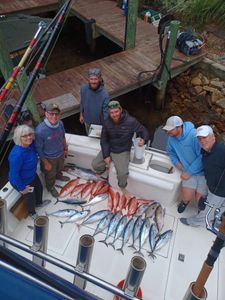 Successful fishing trip displaying Little Tunny and King Mackerel catch on boat deck in Fort Walton Beach FL
