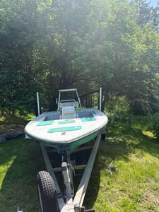 Fishing boat on trailer in wooded area at Old Orchard Beach ME