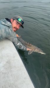 Angler holding fishing rod in Maine