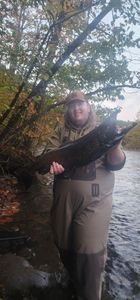 Angler with a big fish while fishing in NY