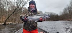 Fisherman with a beautiful rainbow trout caught in Altmar