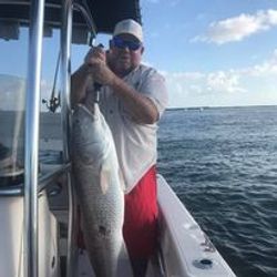 Angler with a big fish caught while fishing in Port Orange