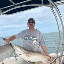 A fisherman with a 28-inch catch in Port Orange