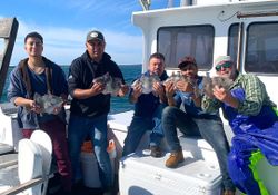 Two fishermen enjoying a great day of fishing in Montauk