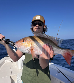 Angler with a 23-inch fish caught in Sarasota while fishing