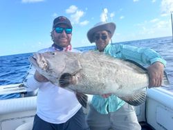 Two people fishing on the beach in Key Largo