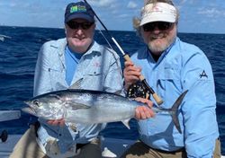 An angler holding a little tunny fish caught in Palm Beach