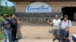 Four friends enjoying fishing trip in MI