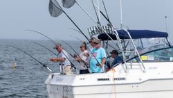 Three people fishing in MI