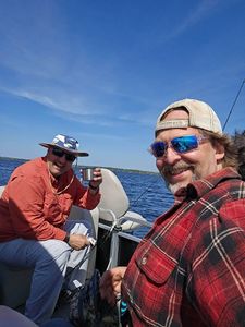 Two anglers fishing on the shore in ON