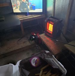 Cozy indoor fishing setup with portable heater and television in Gravenhurst ON
