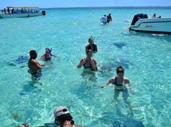 Group of five people fishing in the Cayman Islands
