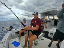 Four people enjoying a fishing trip in the Cayman Islands