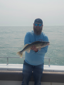A lone fisherman reeling in a catch in Ohio