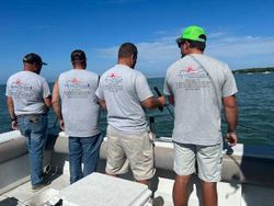 Three anglers fishing in Port Clinton